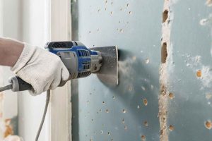 Les outils indispensables pour poncer un mur